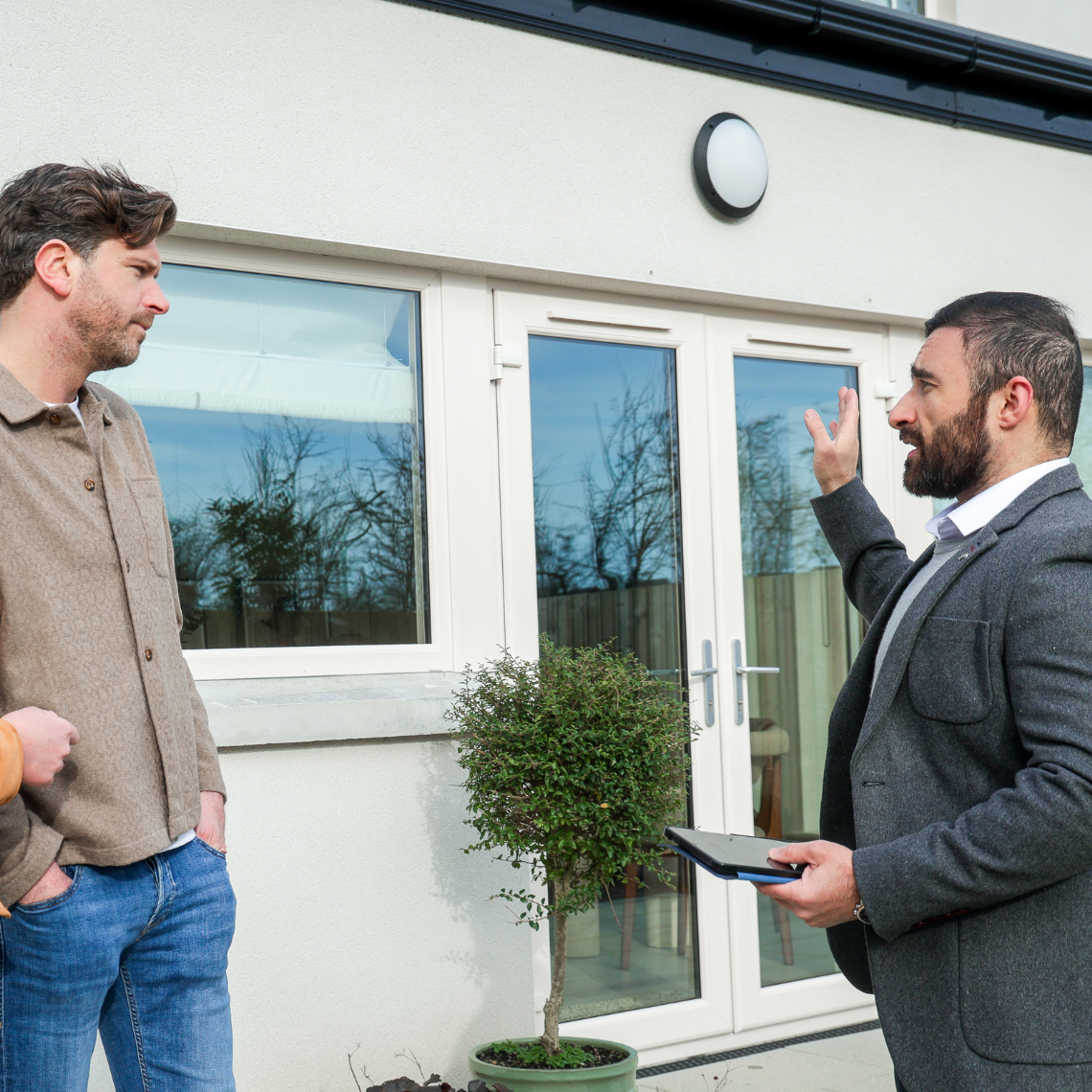 Christine piaras outside with estate agent 1140x1140px