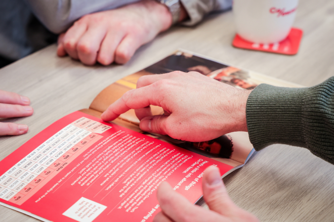 Pointing at brochure